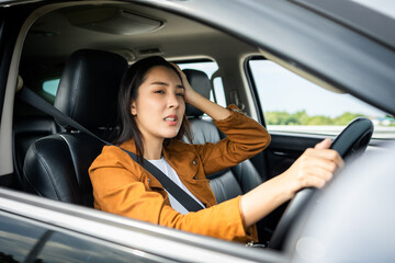 Fototapeta na wymiar Young asian woman has broken down car on the road she feeling serious and stressed.Look for someone help. Driving during rush hour But the traffic is very congested. Shocked face
