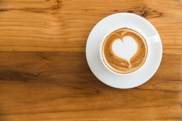 coffee cup on wood table background,Hot latte coffee with latte art