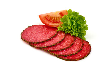 Cold smoked sausage slices covered with herbs and spices, isolated on white background.