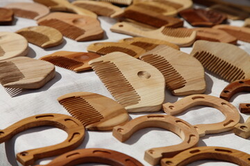 Wooden combs and horseshoes. Russian national traditional souvenirs