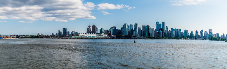 Fototapeta premium A panorama view along the south shore showing the skyline of Vancouver, Canada in summertime