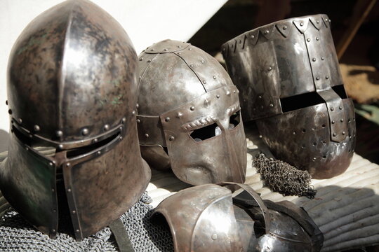 Old Knight helmets closeup. Ancient European armor
