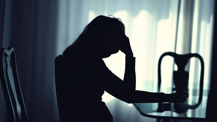 Worried pensive woman suffering at home remembering trauma. Person with mental illness in depression