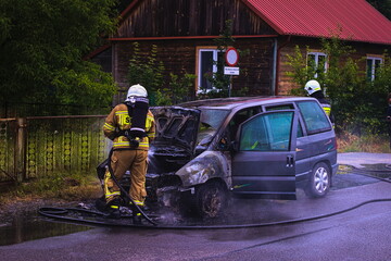 car on fire, rescue operation of the fire brigade