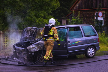 car on fire, rescue operation of the fire brigade