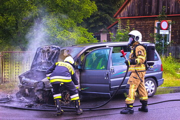 car on fire, rescue operation of the fire brigade