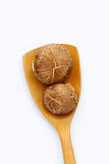 Fresh shiitake mushrooms on white