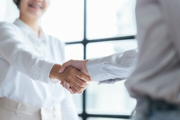 Business people shaking hands. Teamwork colleagues business people handshake after meeting.