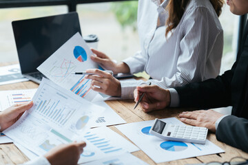 Business people working in the office discussing documents and ideas at meeting, Asian business advisor meeting to analyze and discuss the situation on the financial report.