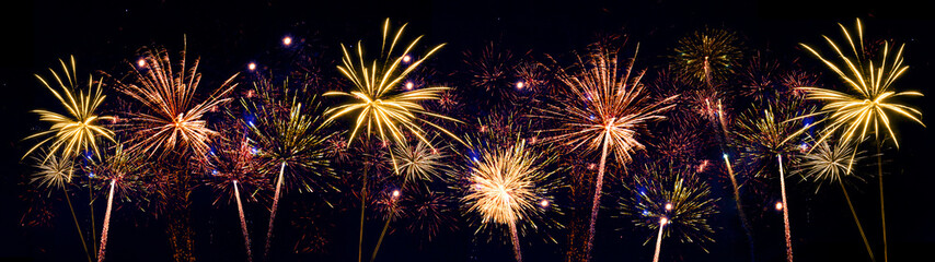 Naklejka premium Fireworks pyrotechnics celebration party event festival holiday or New Year background panorama - Colorful firework on dark night sky