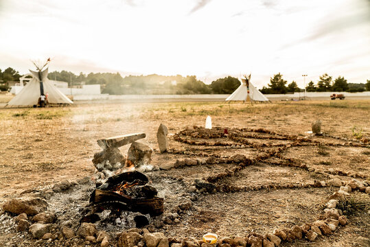 Fire Pit Near To Tipi Camp Site In The Morning Light.