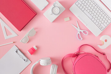 Creative frame of school supplies on pastel pink background. Minimal back to school concept.