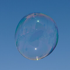soap bubbles on blue sky