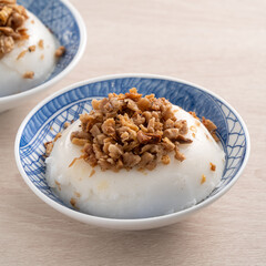 Taiwanese savory rice pudding Wa gui with chopped dried radish and soy sauce