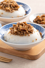 Taiwanese savory rice pudding Wa gui with chopped dried radish and soy sauce