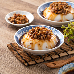 Taiwanese savory rice pudding Wa gui with chopped dried radish and soy sauce