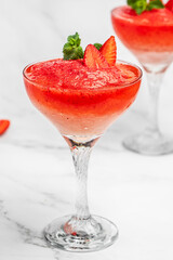Frose cocktail mixed with strawberriess with pink wine. Alcoholic Beverage. Boozy Frozen Rose Frose