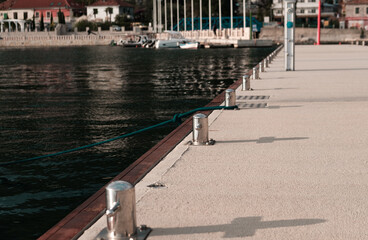 marina pier bollard and bollards in line on harbour background