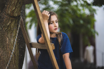 A child on a farm. A cheerful and happy child is playing on the farm. Happy childhood. Farm life.