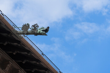 An iron Wawel dragon on the gutter of the roof of the Royal Castle in Krakow will guard the...