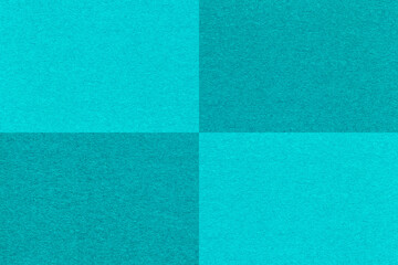 Fototapeta premium Texture of craft cyan and cerulean paper background with cells pattern, macro. Structure of vintage turquoise cardboard.