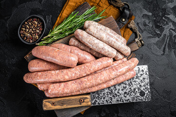 Mix fresh raw sausages. Beef, pork, lamb and chicken mince meat sausages on a butcher cutting board...