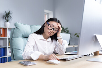 Sad and tired business woman in depression, disappointed with work result, asian woman working in office.