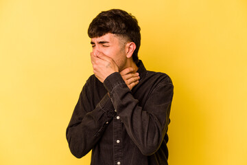 Fototapeta premium Young caucasian man isolated on yellow background suffers pain in throat due a virus or infection.