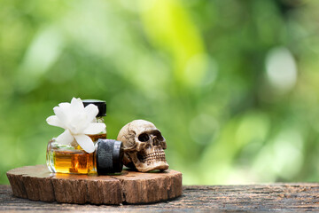 Tuberose flowers and perfume on nature background.