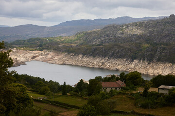 Fototapeta na wymiar Reservoir. Water dam in the Gerês Natural Park (Portugal)