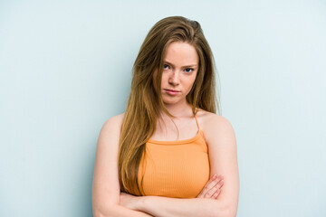 Fototapeta premium Young caucasian woman isolated on blue background who is bored, fatigued and need a relax day.