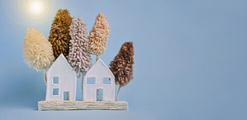 Cute little country houses. Exterior of home and trees. Village cottage among trees. Lying flat...