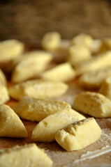 Raw lazy dumplings on a wooden cutting board