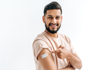 Vaccination concept. Young indian or arabian man getting a vaccine protection the coronavirus and...