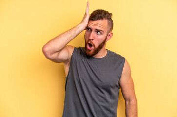 Young caucasian man isolated on yellow background being shocked, she has remembered important...