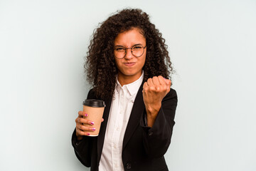 Young business Brazilian woman holding take away coffee isolated on white background showing fist...