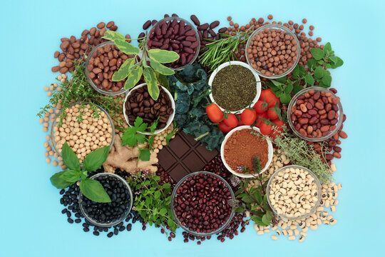 Healthy heart food high in nutrients with legumes, herbs, vegetables, coffee, tea, cacao powder. Health food  high in flavonoids, antioxidants, anthocyanins, vitamins, proteins, minerals, fibre. 
