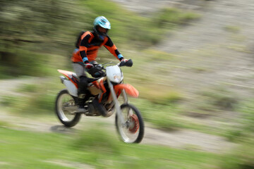 Fototapeta na wymiar Blurry image of motorcycle riders during motocross race