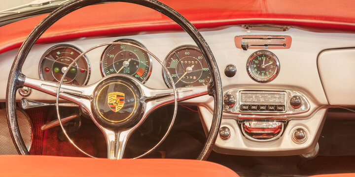Interior of a classic red Porsche convertible sports car in Essen, Germany on March 23, 2022