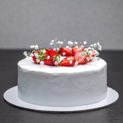 Strawberry homemade cake decorated with gypsophila sprigs
