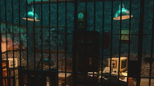 Dark jail cell at night . Hanging Swaying swinging lamps on dark room . Scary , mystic place . Prison life concept . Shot on camera ARRI slow motion	