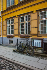 Fototapeta na wymiar Bicycle Near Old House In Old Part Town in Tallin, Estonia