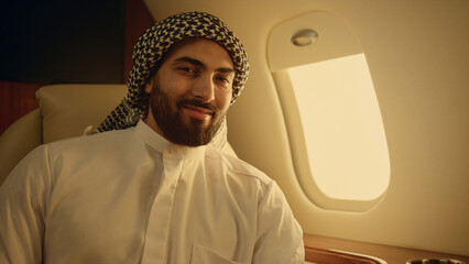 Successful arabian looking camera on luxury flight portrait. Oil company owner