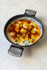 Roasted Green Pepper with Milk in Pan. Traditional Turkish Food. Sutlu Biber Kavurması.