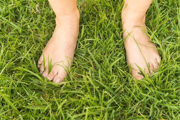 Bare feet on the grass.