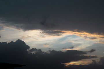 Beautiful orange light with dark clouds at evening time.