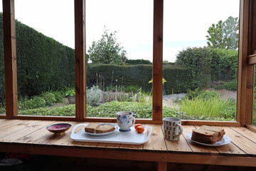 Fototapeta premium A lunchtime snack in a garden shed during a welcome break from work in the garden