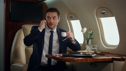 European businessman speaking mobile phone. Successful ceo working business trip