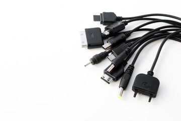 different types of charger connectors for phones, on a white background - obrazy, fototapety, plakaty