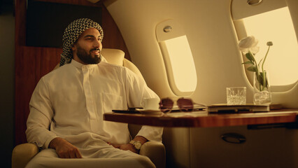 Successful entrepreneur finishing laptop work. Satisfied muslim man thinking